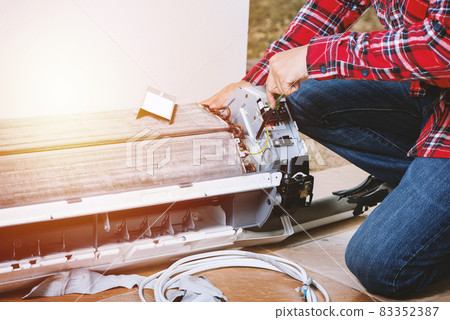 repairing the air conditioner repairing the air conditioner 83352387