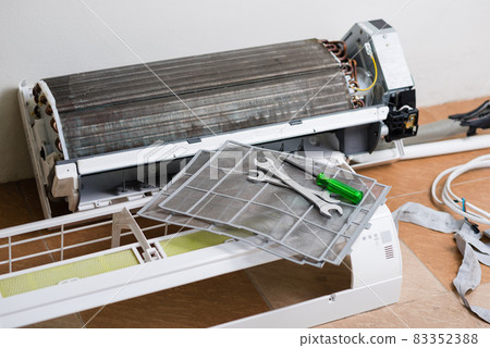 repairing the air conditioner repairing the air conditioner 83352388