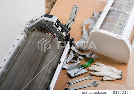 repairing the air conditioner repairing the air conditioner 83352394