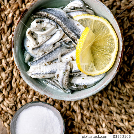 Bowl of pickled anchovies or sardines fillet in oil Bowl of pickled anchovies or sardines fillet in oil 83353166