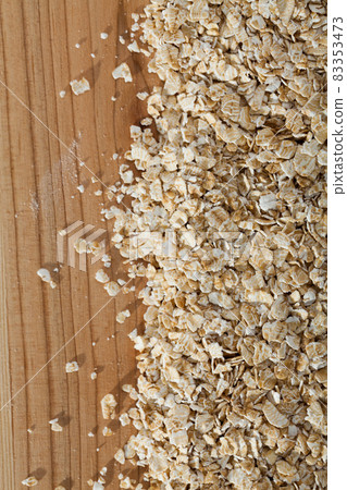 Cereals and healthy eating concept - oatmeal flakes. Cereals and healthy eating concept - oatmeal flakes. 83353473