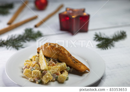 Traditional Christmas dinner in Czech Republic - salmon fillet with potato salad Traditional Christmas dinner in Czech Republic - salmon fillet with potato salad 83353653