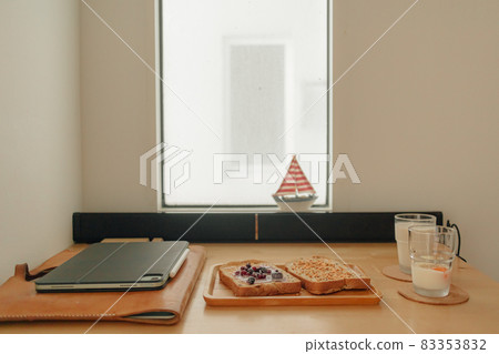 Break time meal sandwich on office desk. 83353832