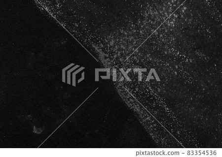 Abstract dark black background. Old ragged paper surface. Copy space 83354536