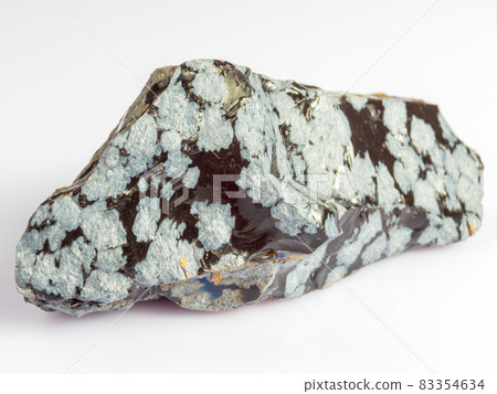 Mineral snow obsidian. The stone is of volcanic origin on a white background. 83354634
