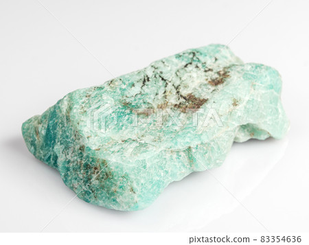 Amazonite on a white background. Exotic ornamental stone. 83354636