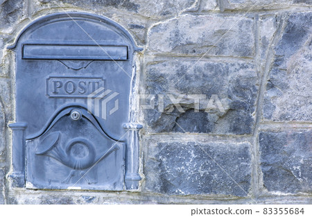 Mailboxes mounted at entry gates, mailboxes embedded in a stone wall, stylish mailboxes. 83355684