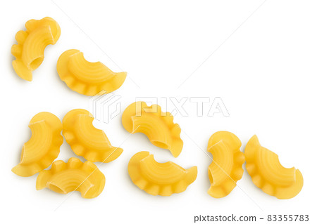 Pasta cornetti creste macaroni isolated on white background with clipping path. Top view with copy space for your text. Flat lay Pasta cornetti creste macaroni isolated on white background with clipping path. Top view with copy space for your text. Flat lay 83355783