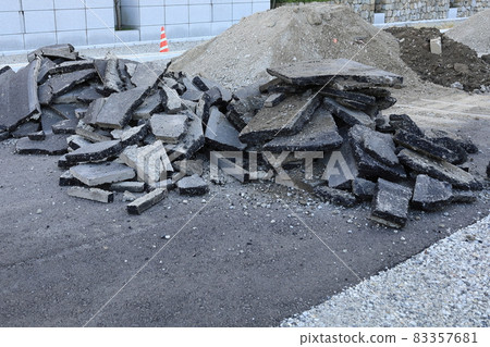 Remnants of asphalt dug up at a road construction site Remnants of asphalt dug up at a road construction site 83357681