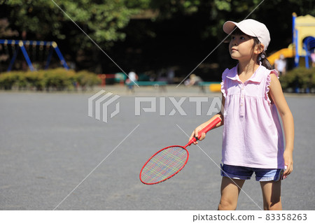 Elementary school girl playing badminton (6 years old) 83358263