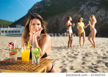 Attractive woman with bright cocktails Attractive woman with bright cocktails 83360593