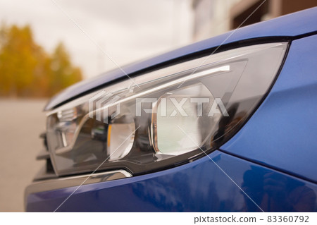 modern car in reflections on blue metallic. 83360792