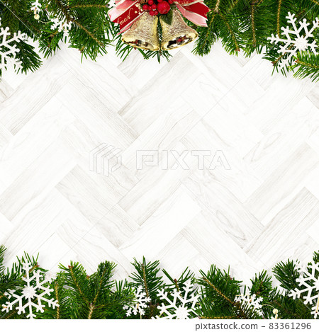 Decorated fir tree branches and white wooden walls Decorated fir tree branches and white wooden walls 83361296