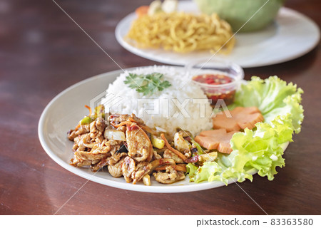 Stir-fried meat with chili  served with steamed rice 83363580