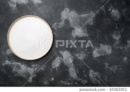 Empty dinner plate with copy space for text or food with copy space for text or food, top view flat lay , on black dark stone table background Empty dinner plate with copy space for text or food with copy space for text or food, top view flat lay , on black dark stone table background 83363952