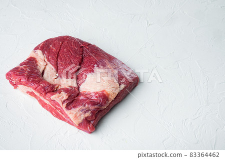 Raw brisket, beef brisket meat, on white stone background, with copy space for text Raw brisket, beef brisket meat, on white stone background, with copy space for text 83364462