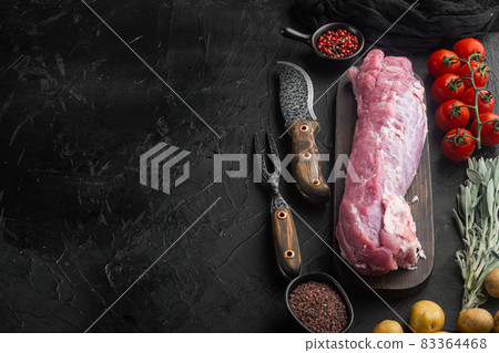 Raw Pork and mash gratin ingredients, on wooden cutting board , with barbeque knife and meat fork, on black stone background , with copyspace and space for text Raw Pork and mash gratin ingredients, on wooden cutting board , with barbeque knife and meat fork, on black stone background , with copyspace and space for text 83364468