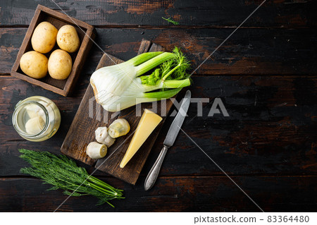Fennel and artichoke with parmesan raw ingredients, on old wooden table, top view with space for text Fennel and artichoke with parmesan raw ingredients, on old wooden table, top view with space for text 83364480