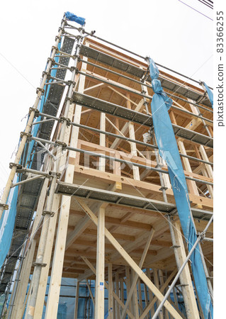 House under construction with scaffolding House under construction with scaffolding 83366255