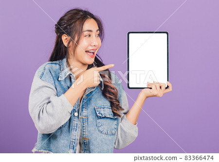 woman confident smiling show blank screen with tablet computer and pointing woman confident smiling show blank screen with tablet computer and pointing 83366474