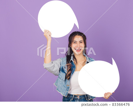 woman smiling excited wear denims hold empty speech bubble sign woman smiling excited wear denims hold empty speech bubble sign 83366476