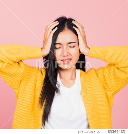 woman sad tired strain face holding hold head by hands 83366485