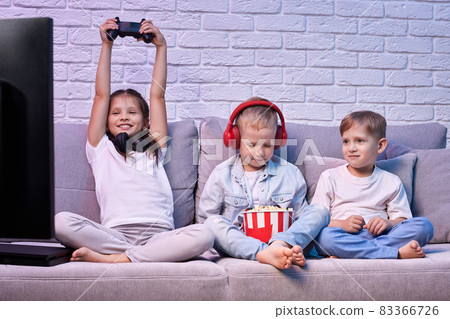 children playing video game with game console 83366726