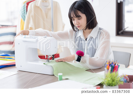 Fashion college student, a young woman sewing clothes 83367308