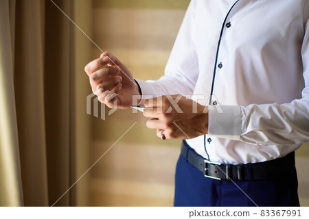 elegant businessman dressed costume before meeting with a partners elegant businessman dressed costume before meeting with a partners 83367991
