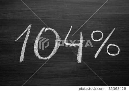 104 percent header written with a chalk on the blackboard 104 percent header written with a chalk on the blackboard 83368426