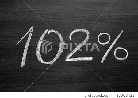 102 percent header written with a chalk on the blackboard 83368428