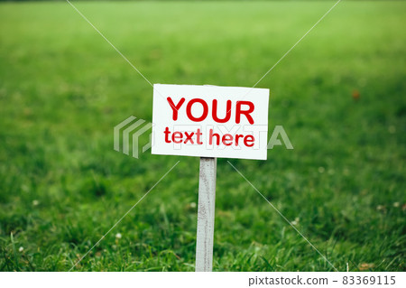 your text here sign against green lawn background your text here sign against green lawn background 83369115
