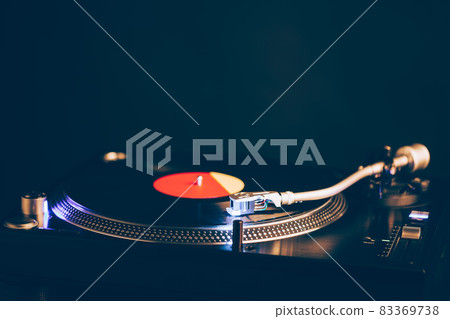 professional dj turntable with illumination, dark background professional dj turntable with illumination, dark background 83369738