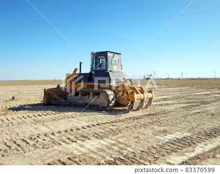 Bulldozer in the steppe. Bulldozer in the steppe. 83370599