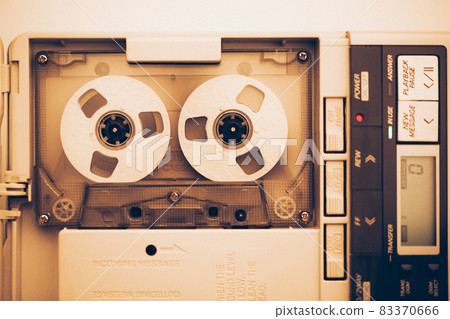 vintage audio tape compact cassette, sepia tone with artistic film noise 83370666