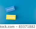 Mental health text written on colorful blue and yellow rectangles on dark blue background with copy space 83371882