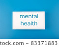 Mental health text written on white rectangle in the middle of dark blue background 83371883