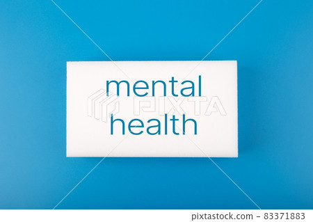 Mental health text written on white rectangle in the middle of dark blue background Mental health text written on white rectangle in the middle of dark blue background 83371883