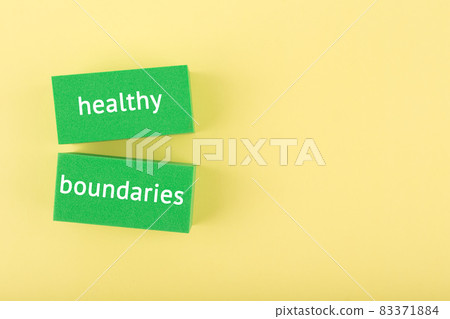 Mental health and healthy boundaries concept on yellow background with copy space Mental health and healthy boundaries concept on yellow background with copy space 83371884