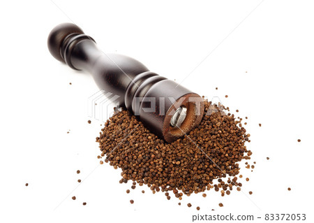 pepper mill on peppercorns heap, isolated on white 83372053