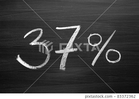 37 percent header written with a chalk on the blackboard 37 percent header written with a chalk on the blackboard 83372362