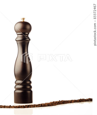 pepper mill and peppercorns, isolated on white pepper mill and peppercorns, isolated on white 83372467