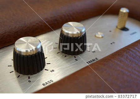 Close-up detail of sound volume controls from the amplifier. Close-up detail of sound volume controls from the amplifier. 83372717