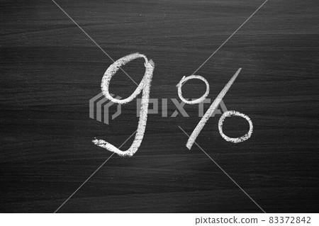 nine percent header written with a chalk on the blackboard nine percent header written with a chalk on the blackboard 83372842