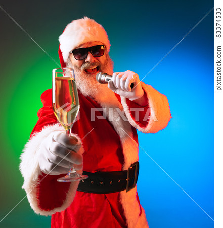 Happy stylish Santa Claus rejoices, has fun, awaits for New Year 2022 and Christmas. Holidays, dreams, joy concept Happy stylish Santa Claus rejoices, has fun, awaits for New Year 2022 and Christmas. Holidays, dreams, joy concept 83374533