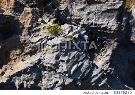 Gole Alcantara Sicilian national park. Alcantara river gorge canyon with volcanic lava caves and rocks. A touristic attraction in Sicily Italy 83376280