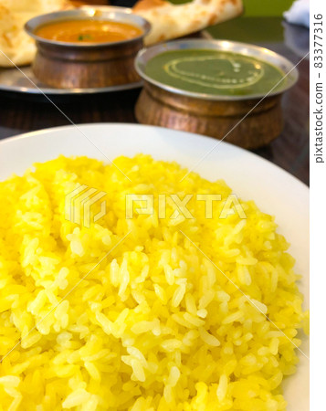 Indian curry and turmeric rice 83377316