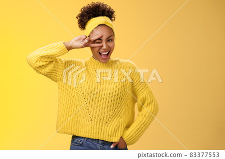 Friendly self-assured energetic african-american smiling healthy girl winking positive attitude grinning cheerful show peace victory lucky gesture hold hand waist confident, yellow background Friendly self-assured energetic african-american smiling healthy girl winking positive attitude grinning cheerful show peace victory lucky gesture hold hand waist confident, yellow background 83377553