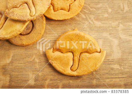 Korean Dalgona honeycomb sugar cookie with umbrella shape to play new trend candy challenge Korean Dalgona honeycomb sugar cookie with umbrella shape to play new trend candy challenge 83378385