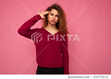 Portrait of young emotional beautiful brunette curly woman with sincere emotions and grimace wearing 83379222